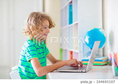 Online remote learning. School kids with computer. 104693107