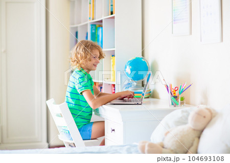 Online remote learning. School kids with computer. 104693108