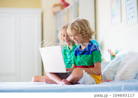 Online remote learning. School kids with computer. 104693117