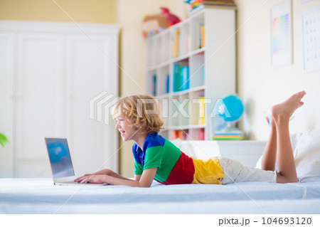 Online remote learning. School kids with computer. Online remote learning. School kids with computer. 104693120