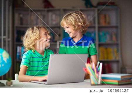 Online remote learning. School kids with computer. Online remote learning. School kids with computer. 104693127
