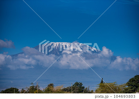 Mount Kilimanjaro is a dormant volcano located in Kilimanjaro Region of Tanzania. It has three volcanic cones: Kibo, Mawenzi, and Shira. It is the highest mountain in Africa and the highest single fre 104693803