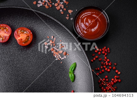 Ingredients for cooking cherry tomatoes, salt, spices and herbs Ingredients for cooking cherry tomatoes, salt, spices and herbs 104694313