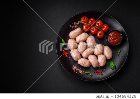 Fresh raw sausages from pork or chicken with salt, spices and herbs 104694329