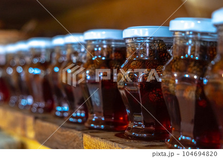 Close-up of glass jars display shelf delicious handmade eco dessert 104694820