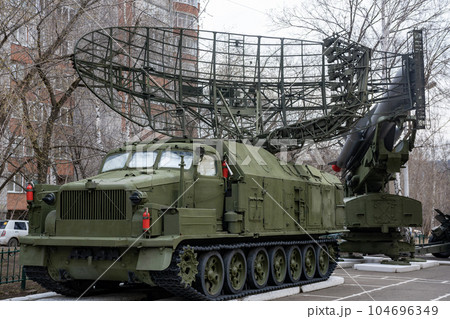 Radar antenna on a green all-terrain vehicle. Radar antenna on a green all-terrain vehicle. 104696349