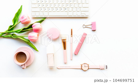 Makeup beauty cosmetic fashion in office. Cosmetics woman working on laptop 104699751