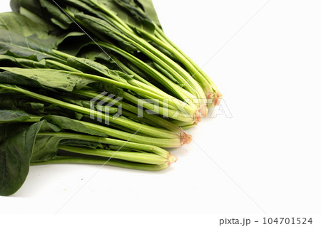 Fresh spinach on white background Fresh spinach on white background 104701524