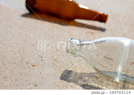 Glass bottles on the beach Glass bottles on the beach 104703114