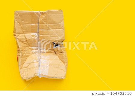 Damaged cardboard box with hole Damaged cardboard box with hole 104703310