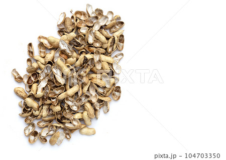 Peanut shells on white background. 104703350