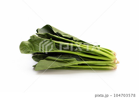 Fresh spinach on white background Fresh spinach on white background 104703578
