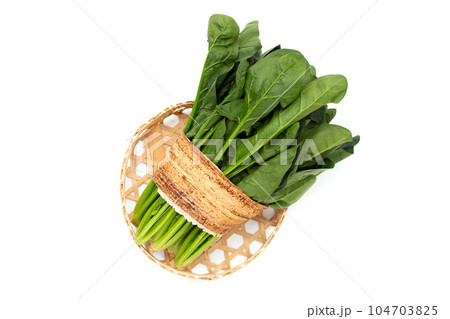 Fresh spinach on white background Fresh spinach on white background 104703825
