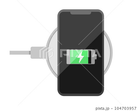 ワイヤレスで充電中のスマホ ワイヤレスで充電中のスマホ 104703957