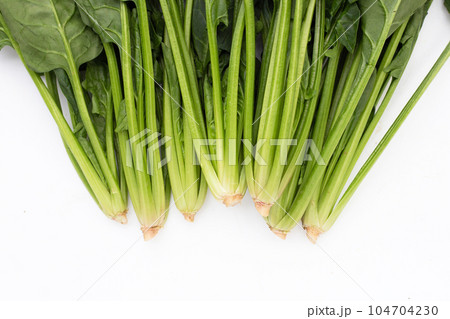 Fresh spinach on white background Fresh spinach on white background 104704230