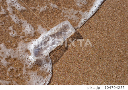 Plastic bottle on the beach 104704285