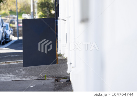 Blank sign standing on pavement with copy space Blank sign standing on pavement with copy space 104704744