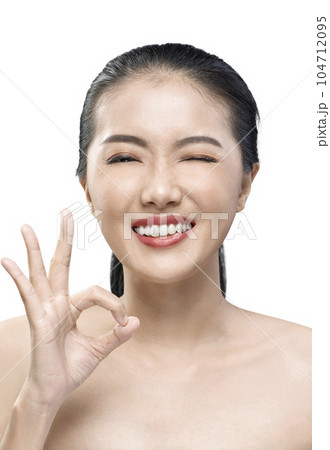Portrait of Asian beauty woman wink with ok gesture Portrait of Asian beauty woman wink with ok gesture 104712095