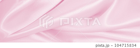 Smooth elegant pink silk or satin texture as wedding background. Luxurious background design Smooth elegant pink silk or satin texture as wedding background. Luxurious background design 104715834
