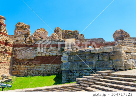 Ancient fortress wall at the entrance of the old town of Nessebar in Bulgaria 104717522