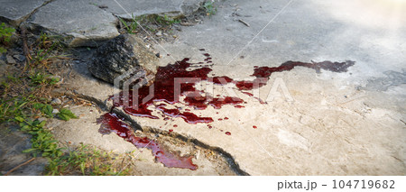 Bloodied stone lies on the ground Bloodied stone lies on the ground 104719682