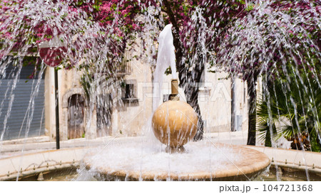 Fountain water falling in Ragusa City Sicily 104721368
