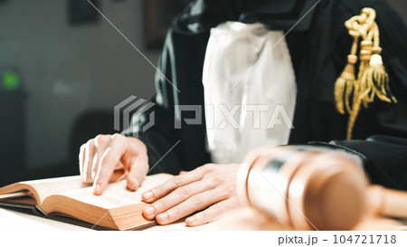 Judge reads the sentence to be afflicted on the criminal in the courtroom 104721718