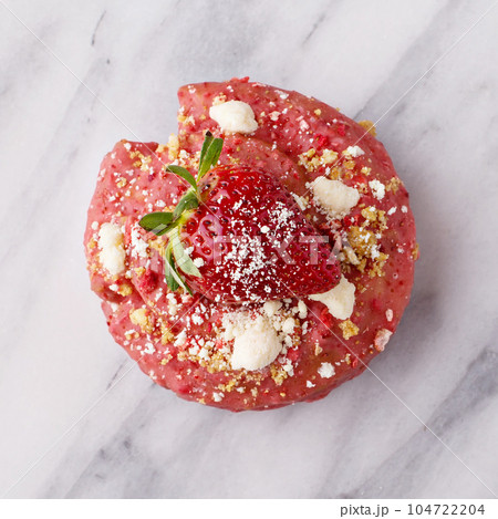 Strawberry shortcake donut on marble surface Strawberry shortcake donut on marble surface 104722204