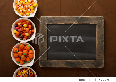 Halloween candy in little white bowls 104722411