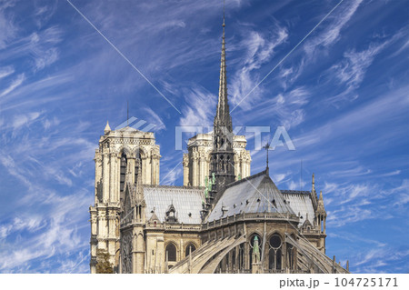 Notre Dame de Paris (against the background of sky with clouds), also known as Notre Dame Cathedral or simply Notre Dame, is a Gothic, Roman Catholic cathedral of Paris, France Notre Dame de Paris (against the background of sky with clouds), also known as Notre Dame Cathedral or simply Notre Dame, is a Gothic, Roman Catholic cathedral of Paris, France 104725171
