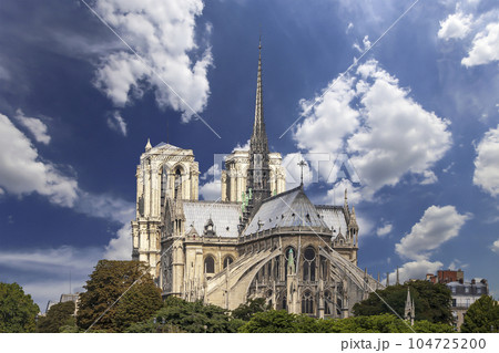 Notre Dame de Paris (against the background of sky with clouds), also known as Notre Dame Cathedral or simply Notre Dame, is a Gothic, Roman Catholic cathedral of Paris, France Notre Dame de Paris (against the background of sky with clouds), also known as Notre Dame Cathedral or simply Notre Dame, is a Gothic, Roman Catholic cathedral of Paris, France 104725200