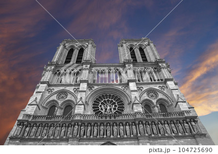 Notre Dame de Paris (against the background of a sky at sunset), also known as Notre Dame Cathedral or simply Notre Dame, is a Gothic, Roman Catholic cathedral of Paris, France 104725690