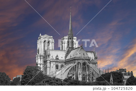 Notre Dame de Paris (against the background of a sky at sunset), also known as Notre Dame Cathedral or simply Notre Dame, is a Gothic, Roman Catholic cathedral of Paris, France Notre Dame de Paris (against the background of a sky at sunset), also known as Notre Dame Cathedral or simply Notre Dame, is a Gothic, Roman Catholic cathedral of Paris, France 104725820