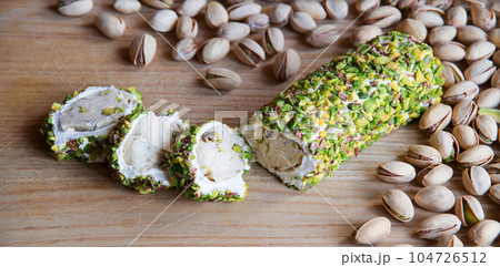 Nuts and halva on the table 104726512