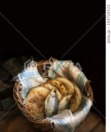 Five loaves and two fish in a basket Five loaves and two fish in a basket 104726522