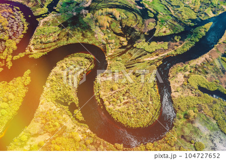 Aerial View Green Forest Woods And River Landscape In Sunny Spring Summer Day. Top View Of Nature, Bird's Eye View. Trees Standing In Water During Spring Flood floodwaters. woods in Water deluge Aerial View Green Forest Woods And River Landscape In Sunny Spring Summer Day. Top View Of Nature, Bird's Eye View. Trees Standing In Water During Spring Flood floodwaters. woods in Water deluge 104727652