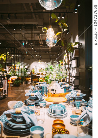 View of assortment of decor for interior shop in store of shopping center. Home accessories and household products for dining room in store of shopping centre. View of beautifully set table. Home View of assortment of decor for interior shop in store of shopping center. Home accessories and household products for dining room in store of shopping centre. View of beautifully set table. Home 104727668