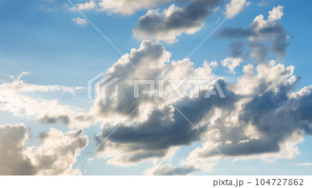 Bright clouds in the evening sky Bright clouds in the evening sky 104727862