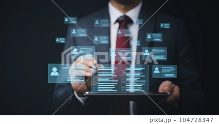 Businessman hand touch Online documentation database, complete the online survey form, answer the test questions. Marked checklist on a clipboard. Human resources and management concept. Businessman hand touch Online documentation database, complete the online survey form, answer the test questions. Marked checklist on a clipboard. Human resources and management concept. 104728347