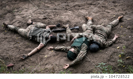 Wounded soldiers lie on the battlefield 104728522