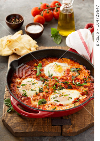 Shakshuka with chickpeas in a skillet Shakshuka with chickpeas in a skillet 104729647