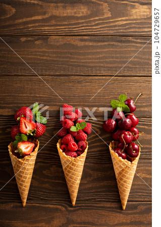 Fresh fruit and berries in waffle cones 104729657