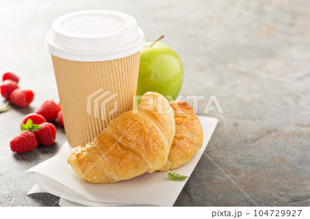 Coffee to go with croissants 104729927