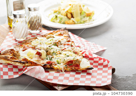 Big slice of pepperoni pizza Big slice of pepperoni pizza 104730390