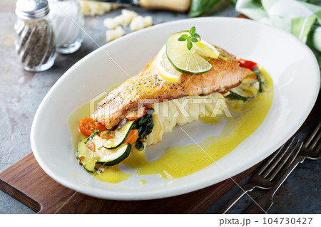 Salmon with vegetables and mashed potatoes Salmon with vegetables and mashed potatoes 104730427