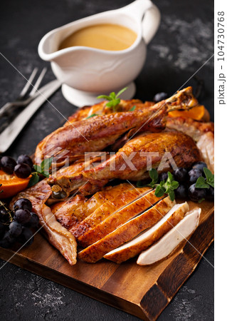 Carved turkey on a cutting board Carved turkey on a cutting board 104730768