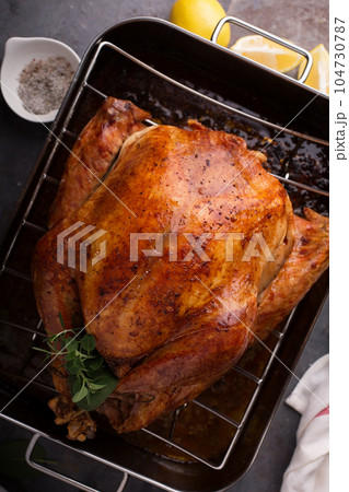 Cooked turkey ready for carving Cooked turkey ready for carving 104730787