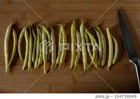 Yellow and green kidney beans on wooden background 104738049