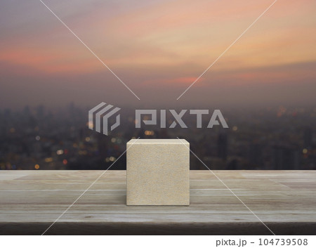 Wood block cube on wooden table Wood block cube on wooden table 104739508