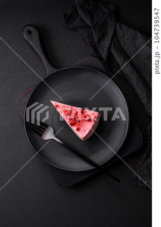 Delicious sweet dessert cheesecake with raspberry and pistachio flavor Delicious sweet dessert cheesecake with raspberry and pistachio flavor 104739547